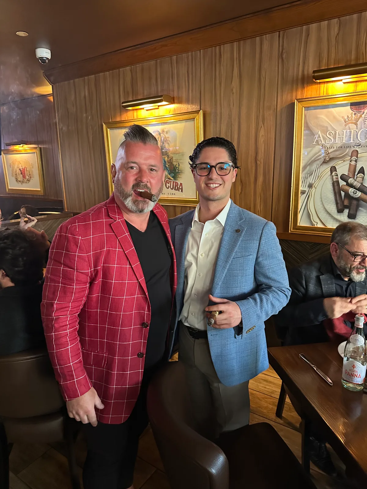 Two guests catching up in the lounge