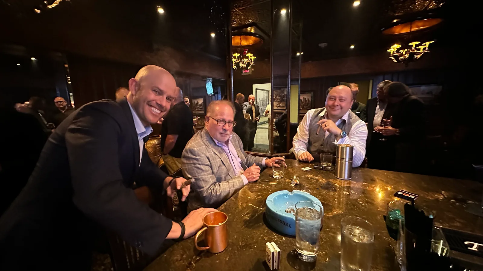 Guests sharing a conversation at the lounge bar